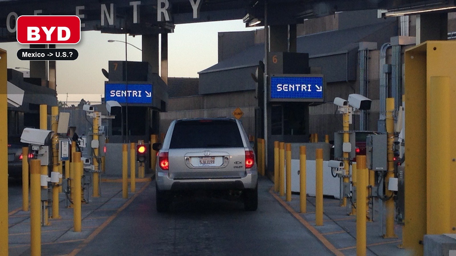 BYD editorial badge over a vehicle entering the San Ysidro Port of Entry SENTRI lanes between Mexico and the United States.
