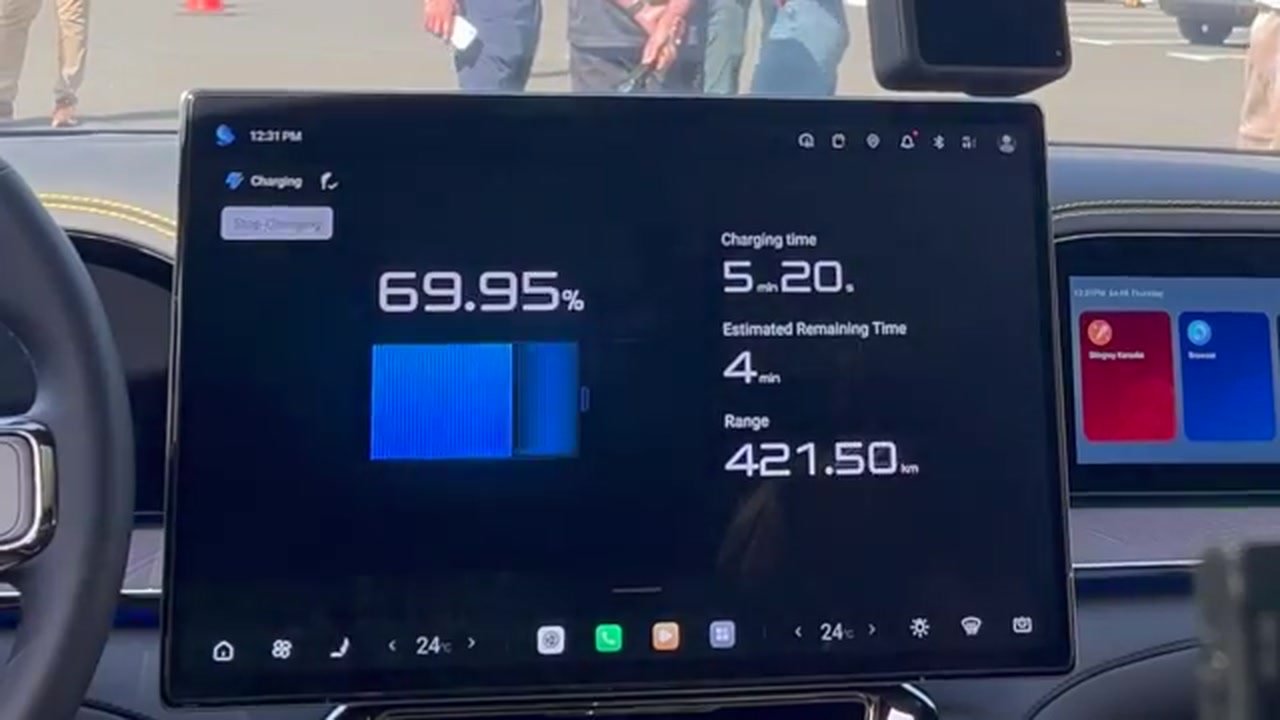 Denza Z9 GT charging screen showing 69.95 percent after 5 minutes 20 seconds