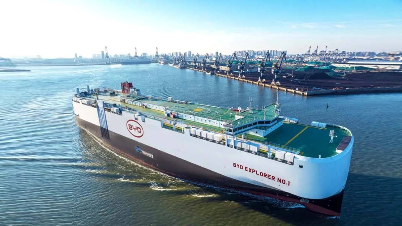 BYD EXPLORER NO.1 car carrier sailing beside a port.