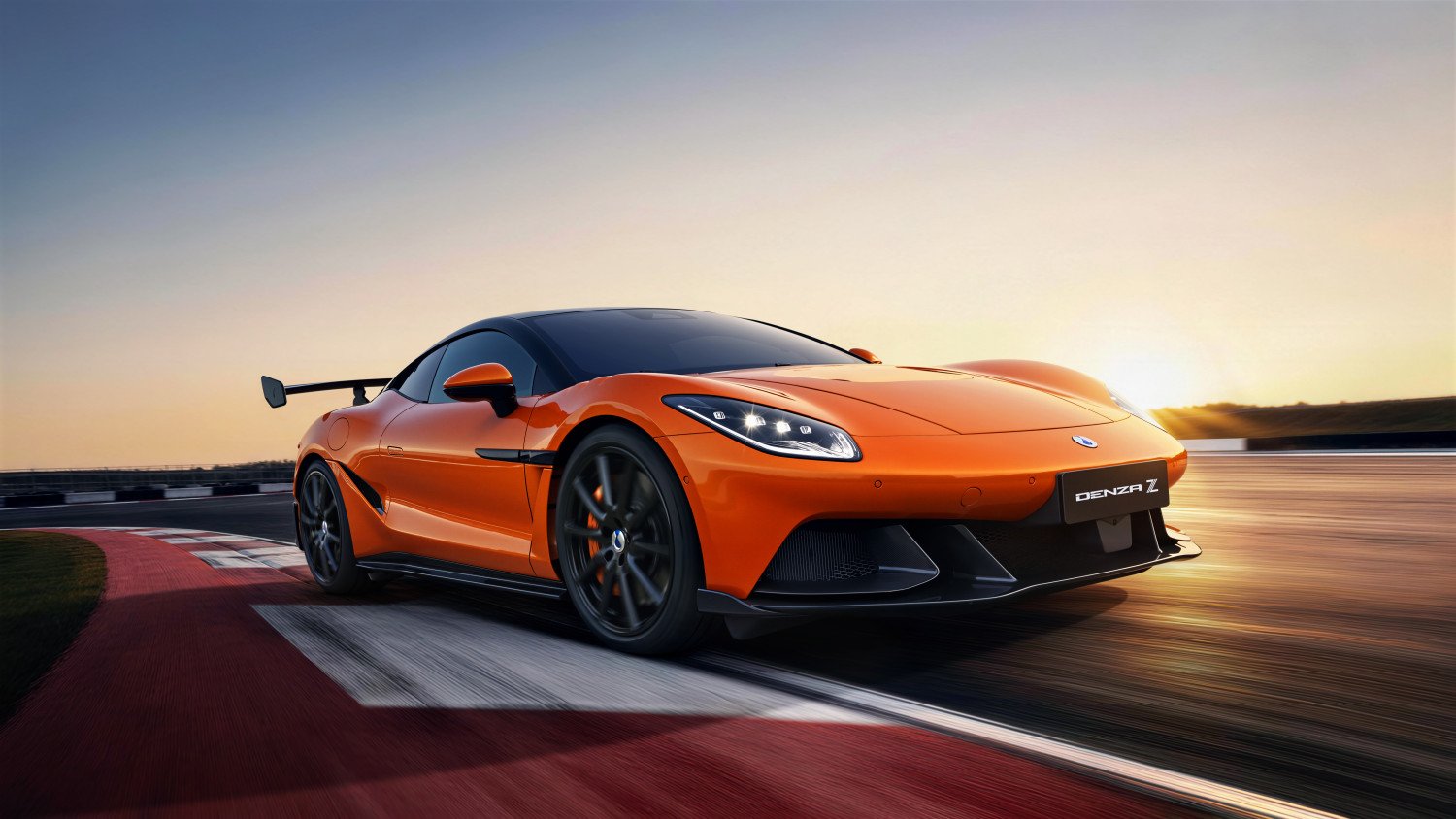 Orange Denza Z Racing driving on a race track