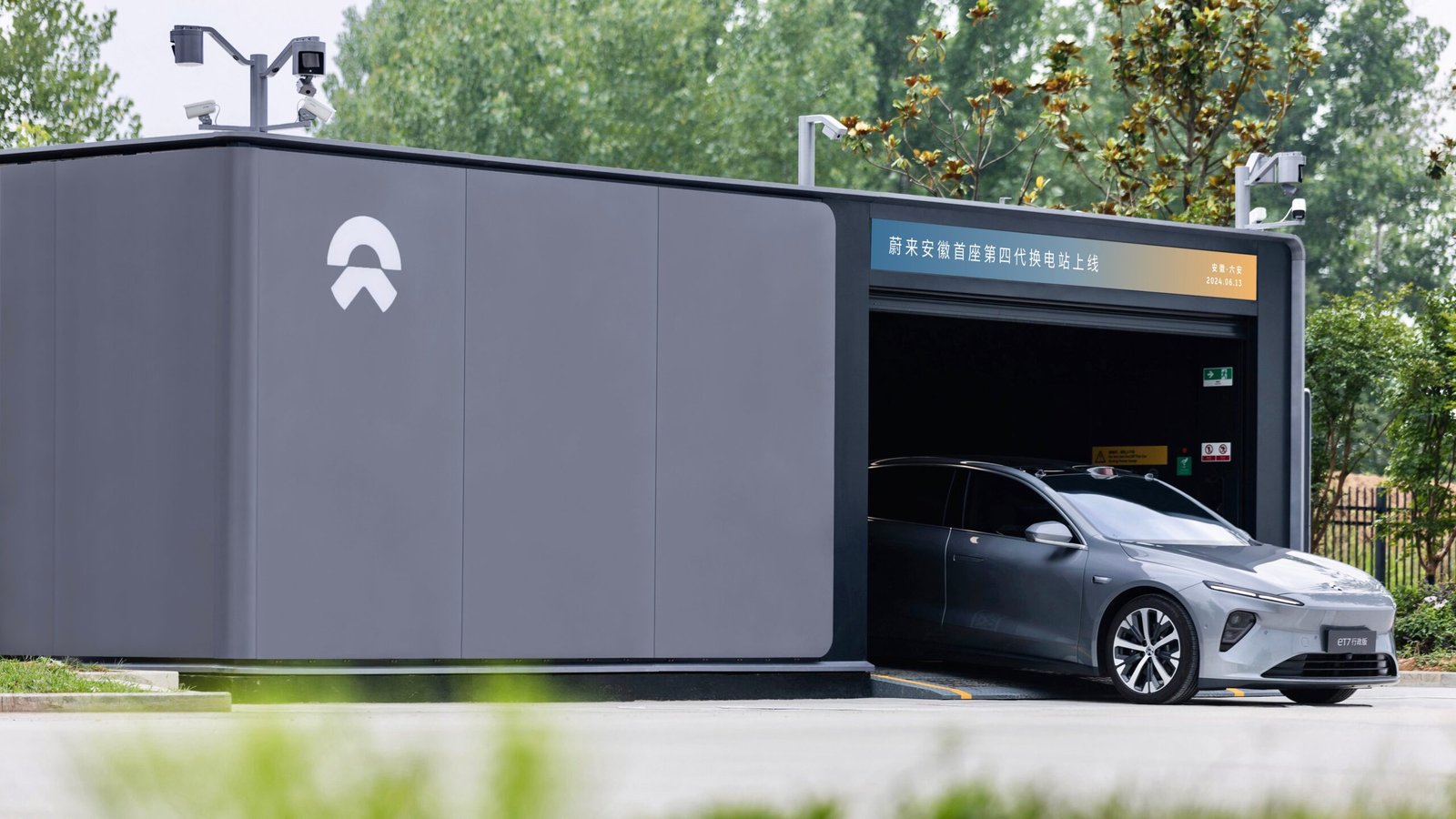 NIO Power Swap Station 4.0 with a vehicle exiting the swap bay