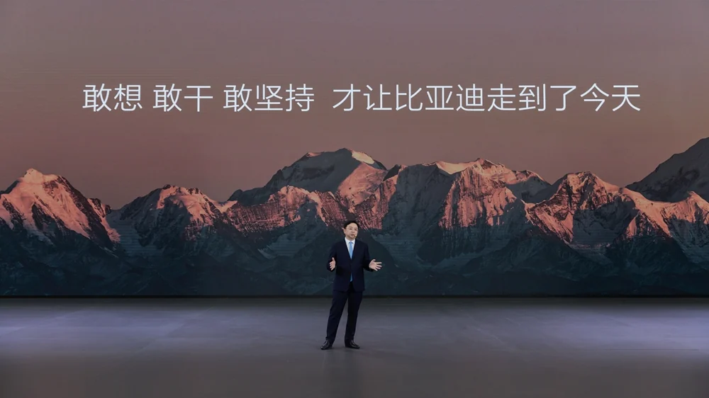 Wang Chuanfu speaking on stage during BYD's 30th anniversary event