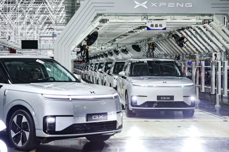 XPeng GX-based robotaxi vehicles on a production line in Guangzhou