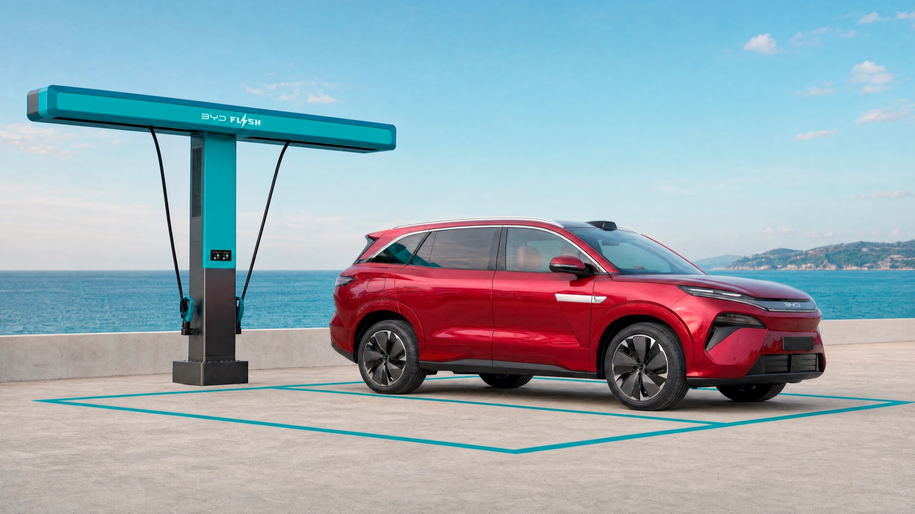 Red European battery-electric BYD ATTO 8 beside a BYD Flash Charging unit in an official promotional rendering
