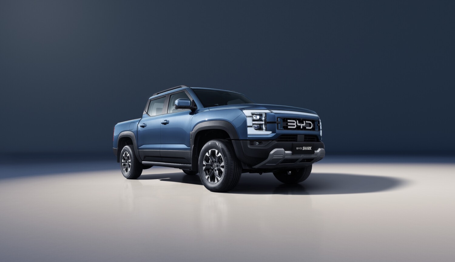 Blue BYD SHARK plug-in hybrid pickup in BYD's official July 2026 product visual